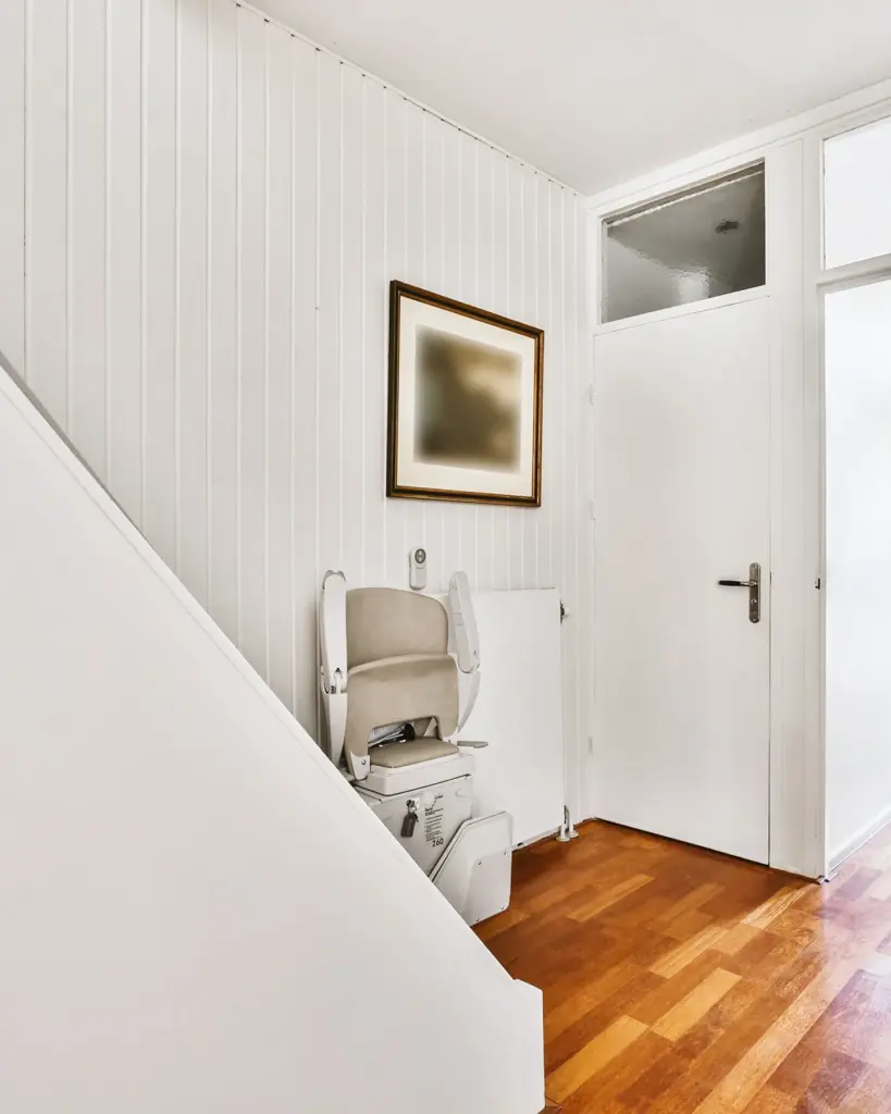 Professional stairlift installed in bright residential hallway