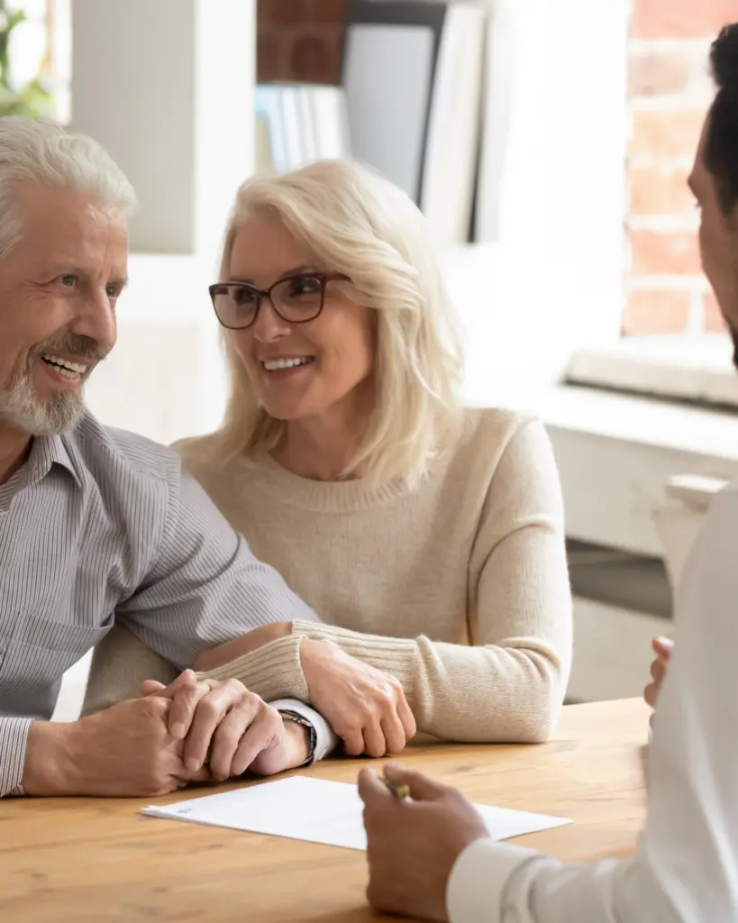 Licensed stairlift installer consulting with senior homeowners