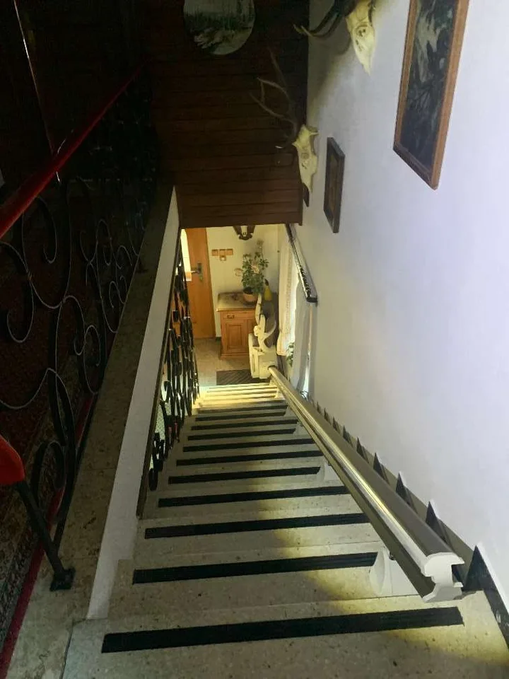 Straight stairlift installation in Bellaire, TX — Post-Harvey raised Bellaire ranch — 13-step outdoor lift to the new front door — photo 4