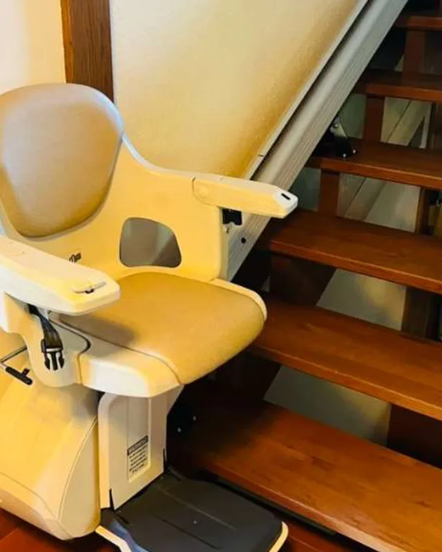 Straight stairlift installation in Coral Gables, Florida &mdash; 1934 Mediterranean — rail color-matched to the original oak banister