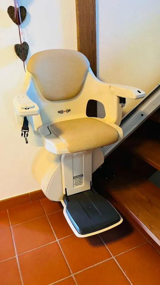 Straight stairlift installation in The Heights, TX — 1924 Heights bungalow — outdoor rail on 8 original pier-raised porch steps — photo 2